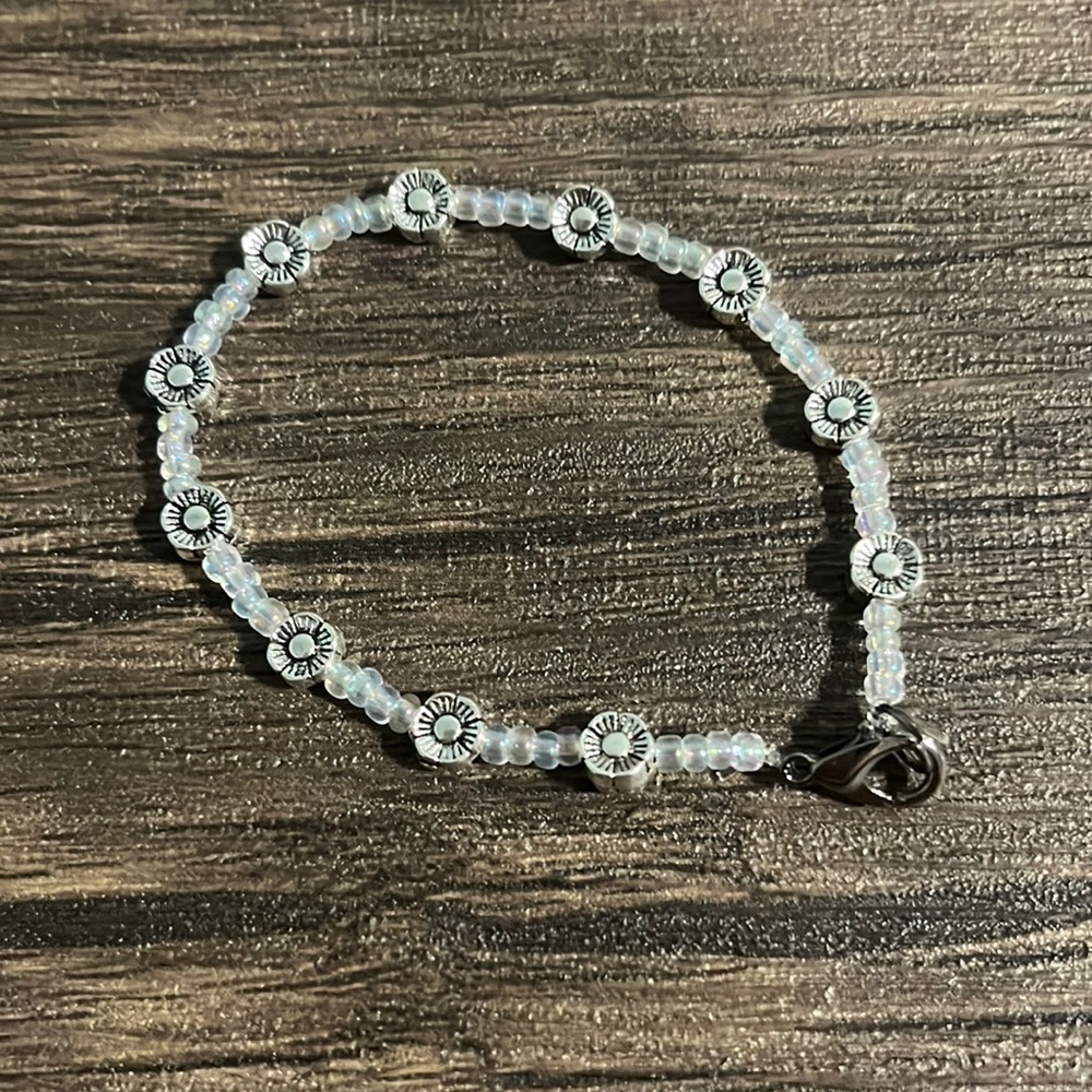 Beaded bracelet with clear and flower beads for size small/medium wrist. 6.5 in.